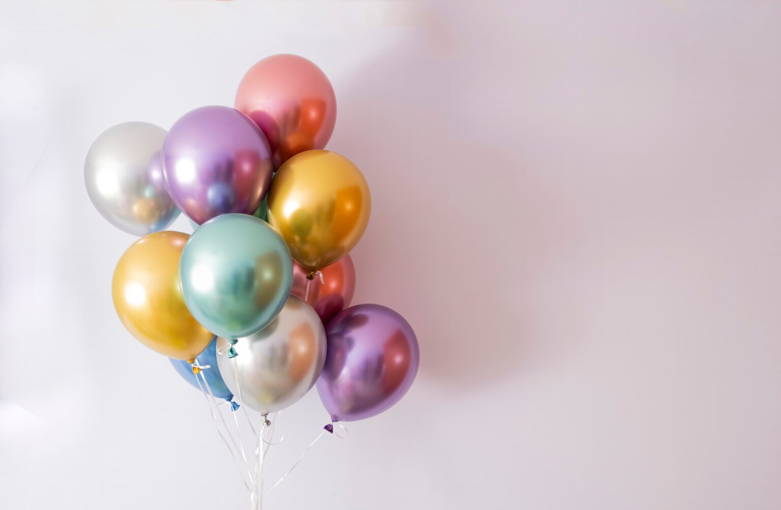 Ten Helium Balloons In Metallic Colors On A Mauve Background, Co
